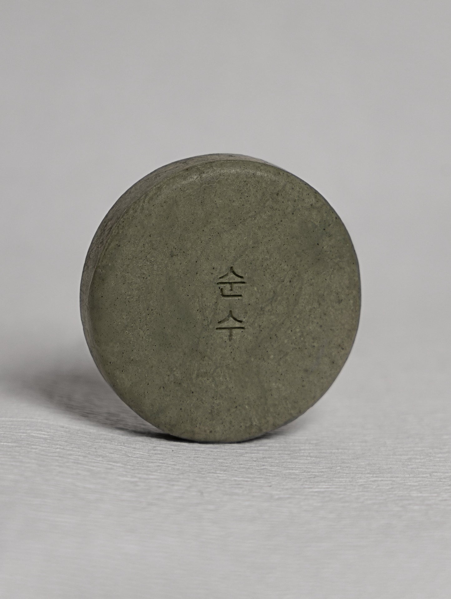 Ondo Beauty 36.5's BHA & Ginger Shampoo Bar against a light grey background. Available for purchase at Sinless Skincare.