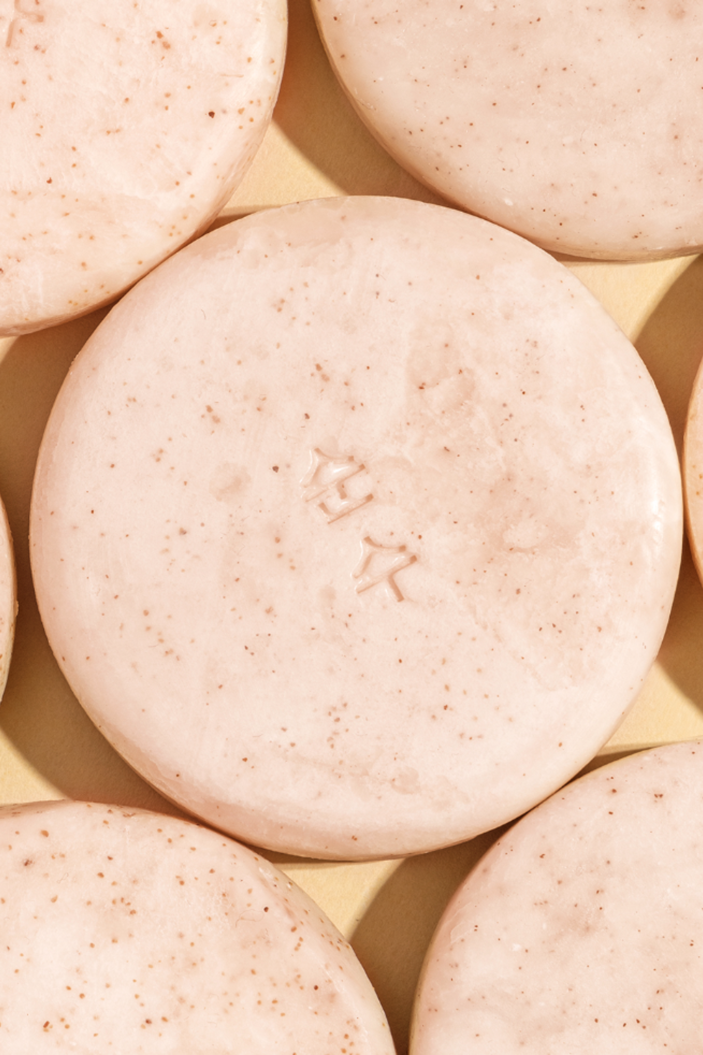 Close up shot of Ondo Beauty 36.5 Panthenol & Coconut Shampoo bar outside of the box. Available for purchase at Sinless Skincare.