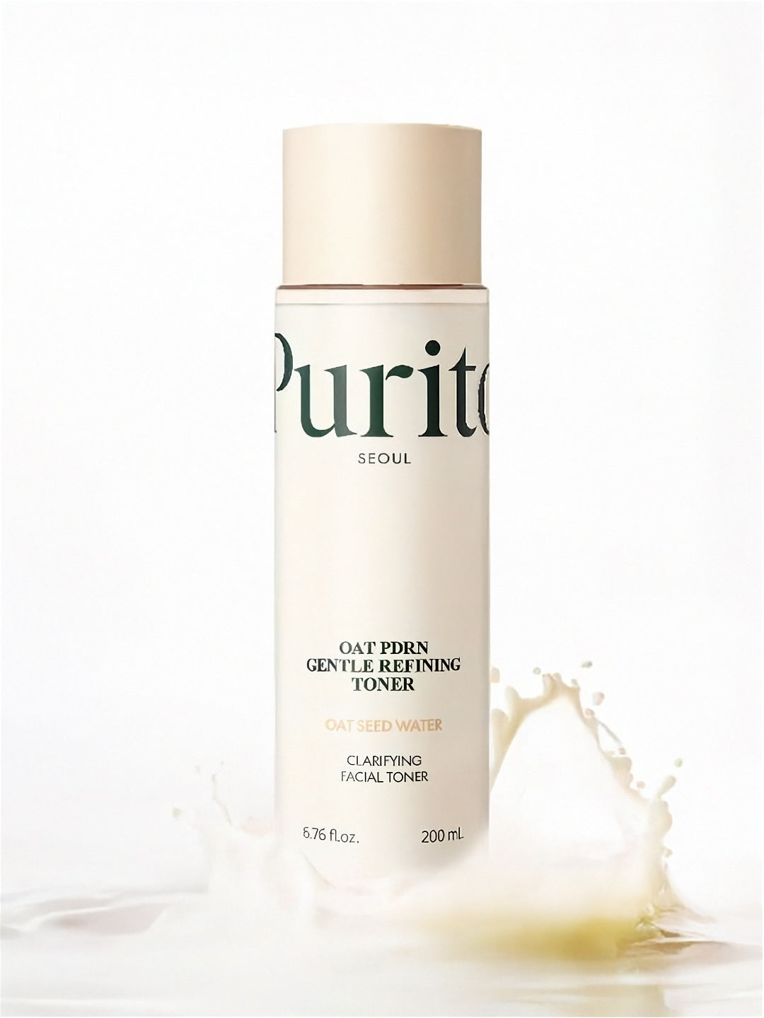 Purito Oat PDRN Gentle Refining Toner bottle with a splash of white liquid on a white background