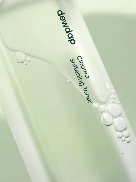 Close up of Dewdap Cicatea Softening Toner with a light green background.