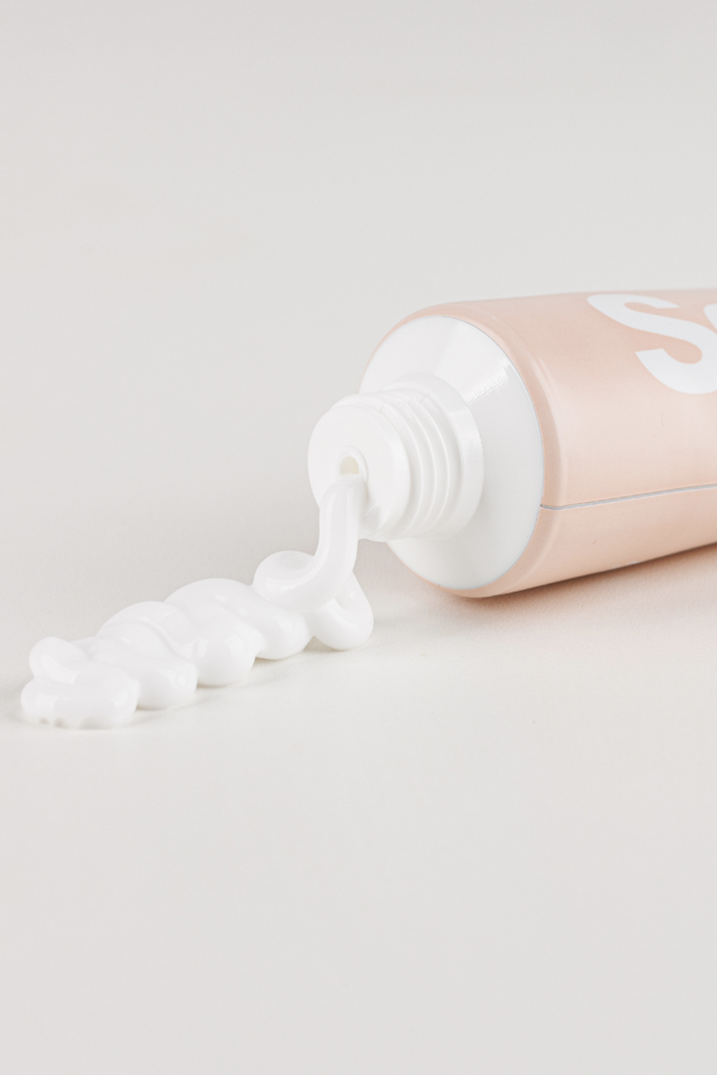 Close up of the top of Vegreen's 730 Daily Moisture Cream lying down with cream coming out.