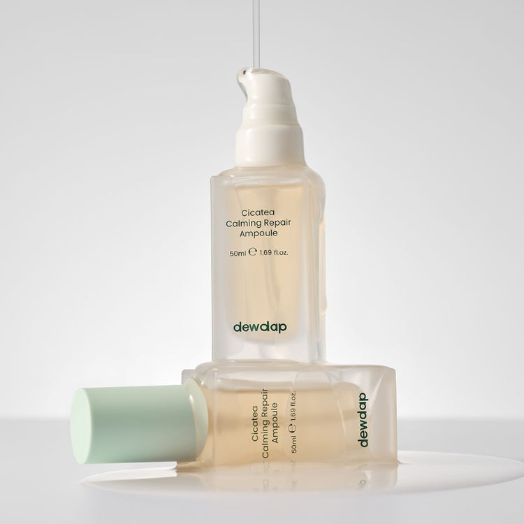 Two bottles of Dewdap Cicatea Calming Repair Ampoule on a light grey background
