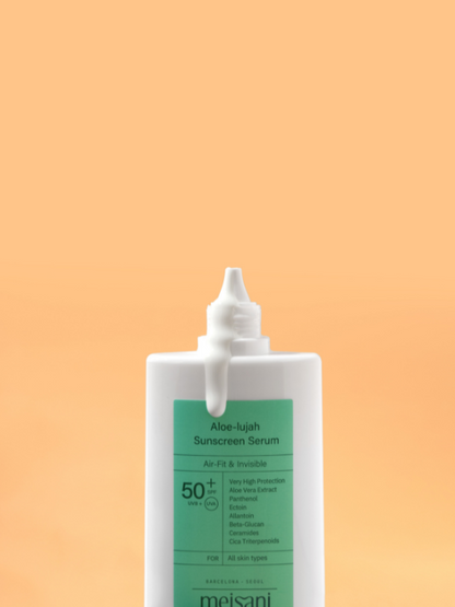 Meisani Aloe-lujah Sunscreen Serum uncapped with cream running down the front of the bottle. Light orange background.