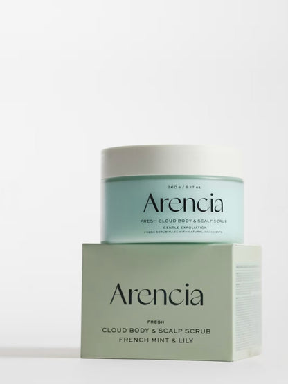 A jar of Arencia Cloud Body & Scalp Scrub French Mint & Lily stacked on top of its matching product box, set against a clean white background.