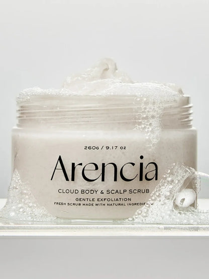 A jar of Arencia Cloud Body & Scalp Scrub, (White Tea & Neroli) with white foam and bubbles, shown on a clean white background.