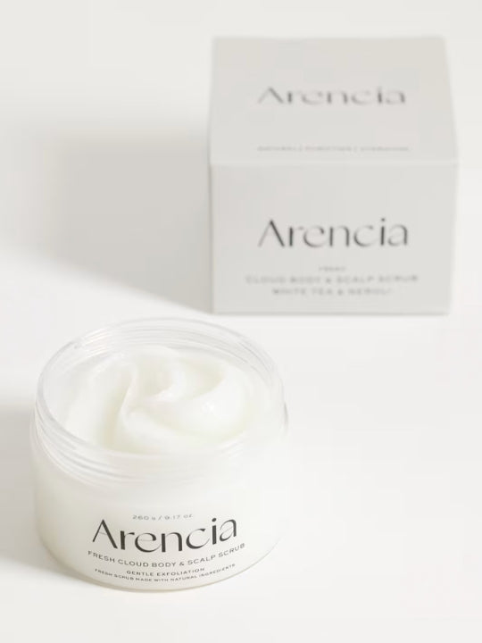 A jar of Arencia Cloud Body & Scalp Scrub, (White Tea & Neroli) with white cream visible inside, shown in front of its matching white product box on a clean white background.