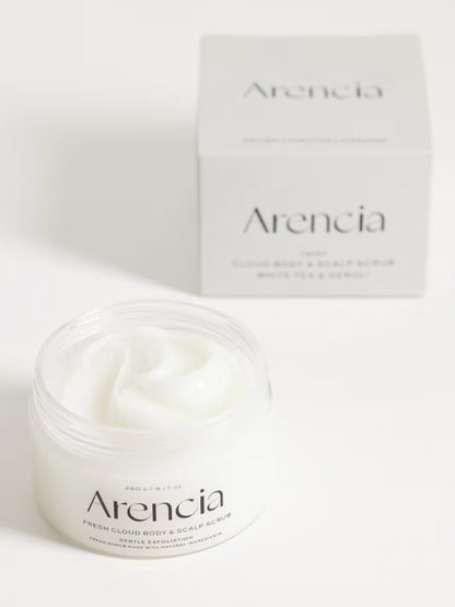 A jar of Arencia Cloud Body & Scalp Scrub, (White Tea & Neroli) with white cream visible inside, shown in front of its matching white product box on a clean white background.
