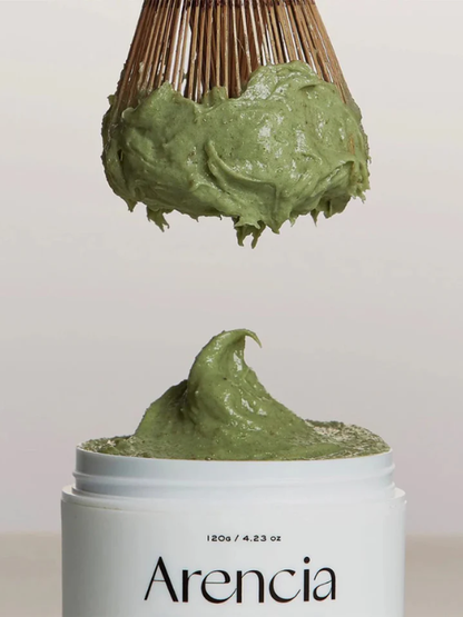 Open jar of Arencia Fresh Green Rice Mochi Cleanser with a matca whisk hanging above. Available at Sinless Skincare.