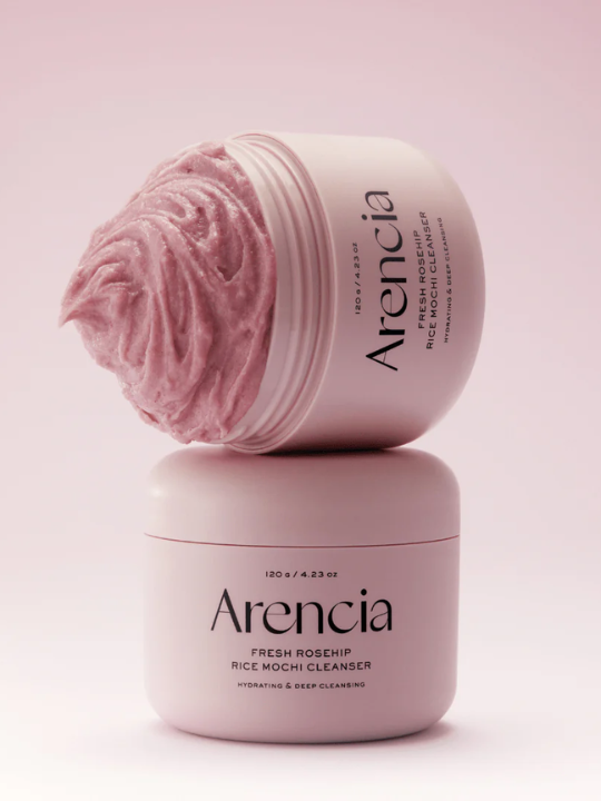Two jars of Arencia Fresh Rosehip Rice Mochi Cleanser on a pink background