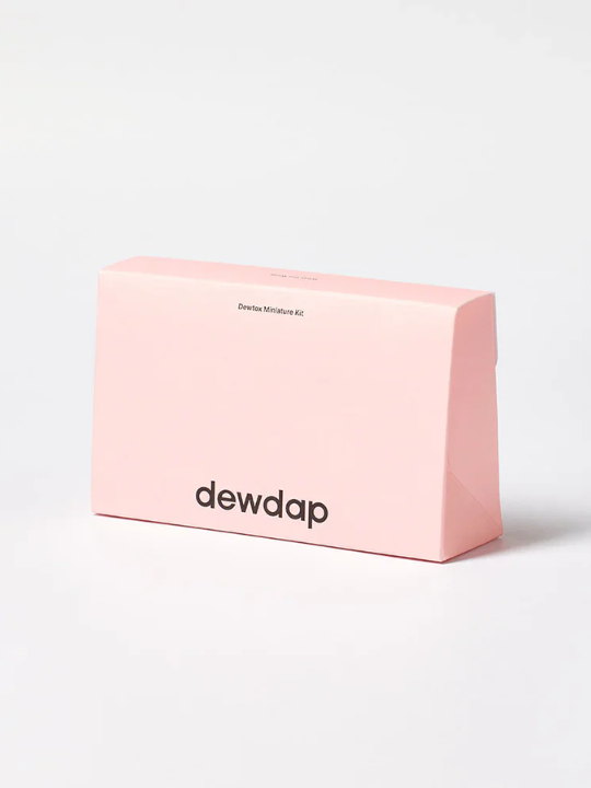 Dewdap Dewtox Miniature Kit closed box on a light grey background. Available at Sinless Skincare Switzerland.