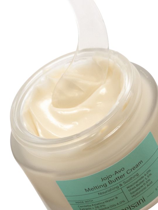 Open jar of Meisani Jojo-Avo Melting Butter Cream with spatula - on a white background