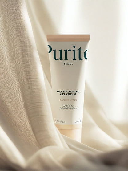 Tube of Purito Oat In Calming Gel Cream on neutral beige fabric and light background