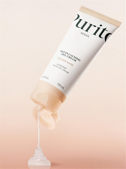 Tube of Purito Seoul Oat In Calming Gel Cream with cream being squeezed out on a beige background