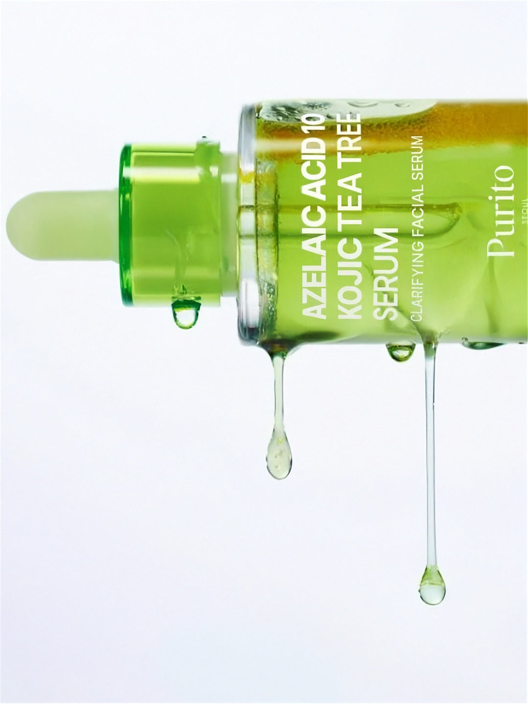 Purito Seoul Azelaic Acid 10 Kojic Tea Tree Serum on its side with green serum dripping down, on a white background