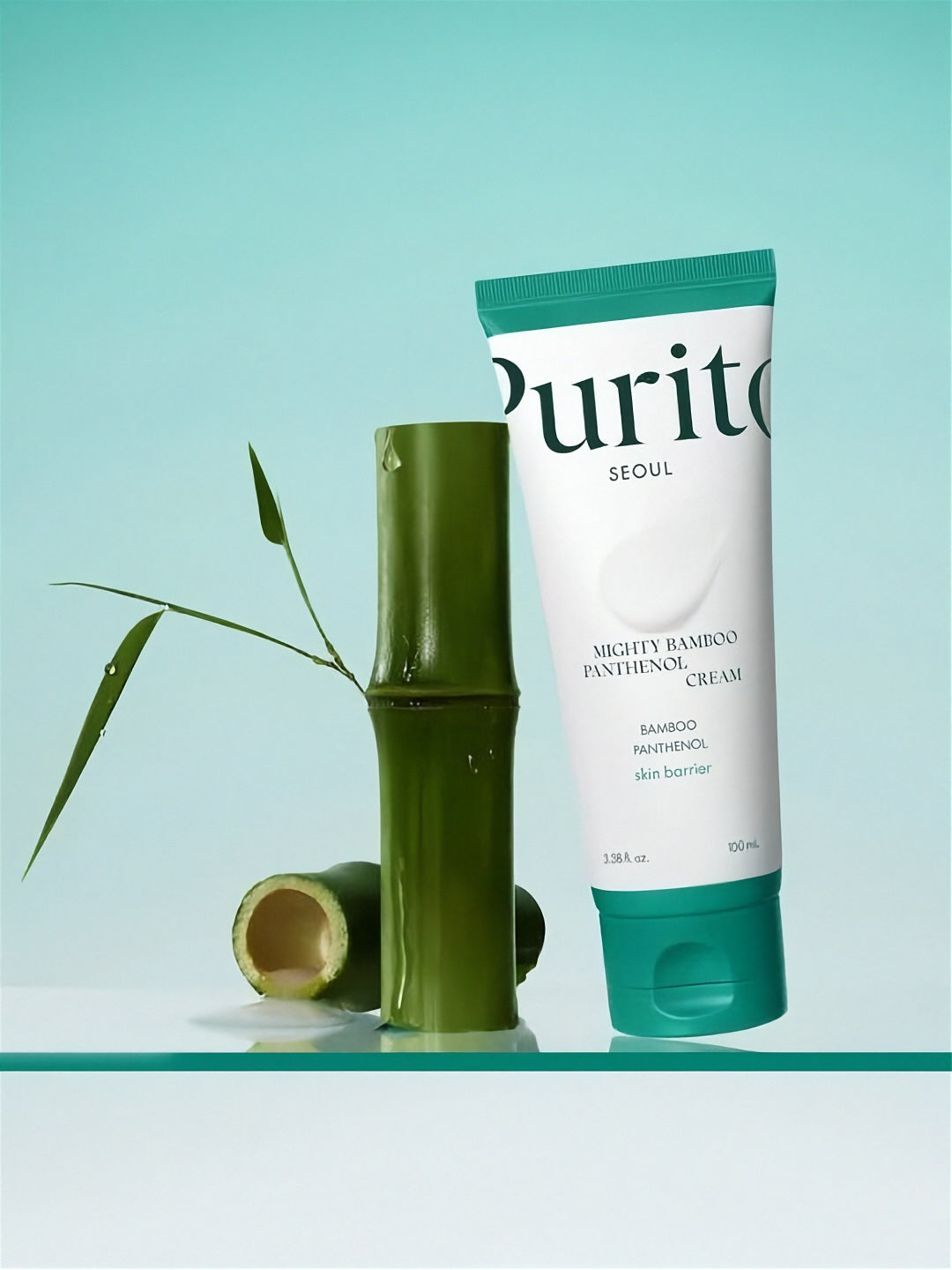 Purito Mighty Bamboo Panthenol Cream with bamboo plant on a light turquoise background