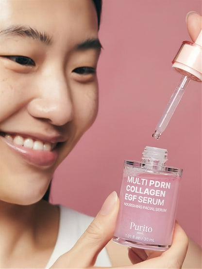 Person holding a bottle of Purito Multi PDRN Collagen EGF Serum on a pink background