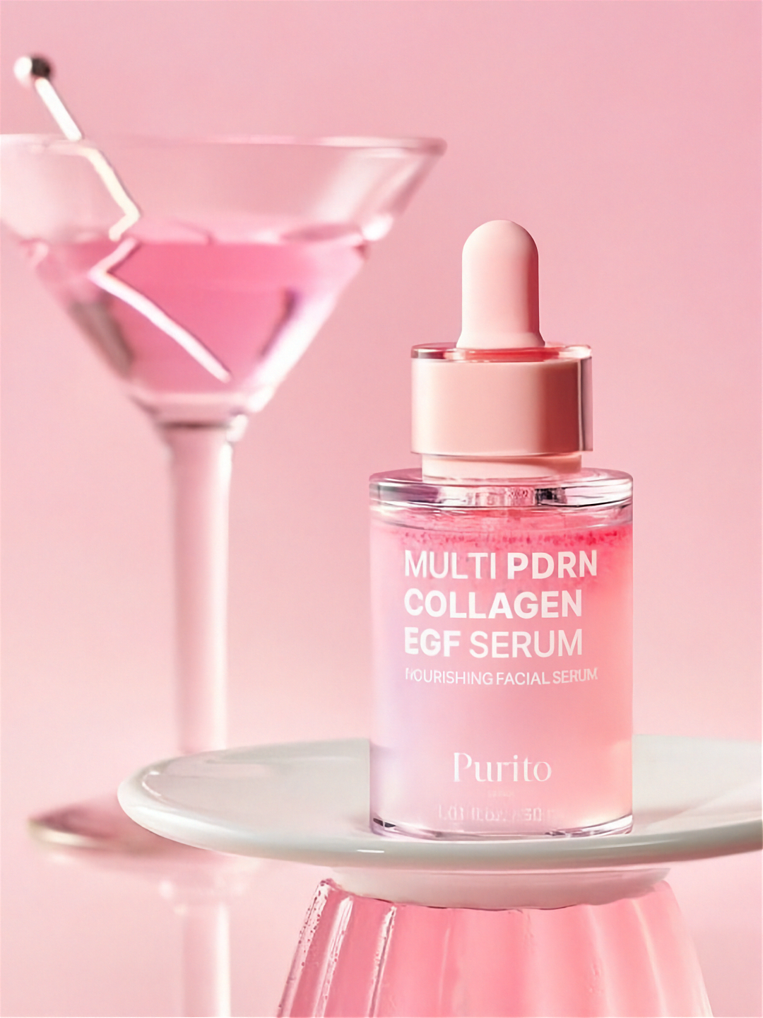 Purito Multi PDRN Collagen EGF Serum with a pink martini glass on a pink background