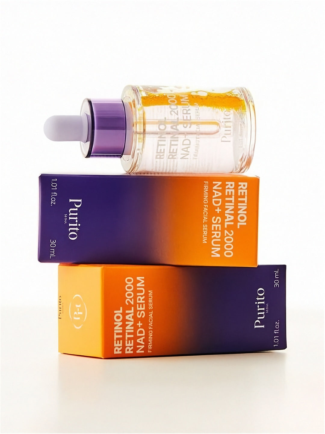 Purito Retinol Retinal 2000 NAD+ Serum bottle lying sideways on two of its retail boxes againt a white background