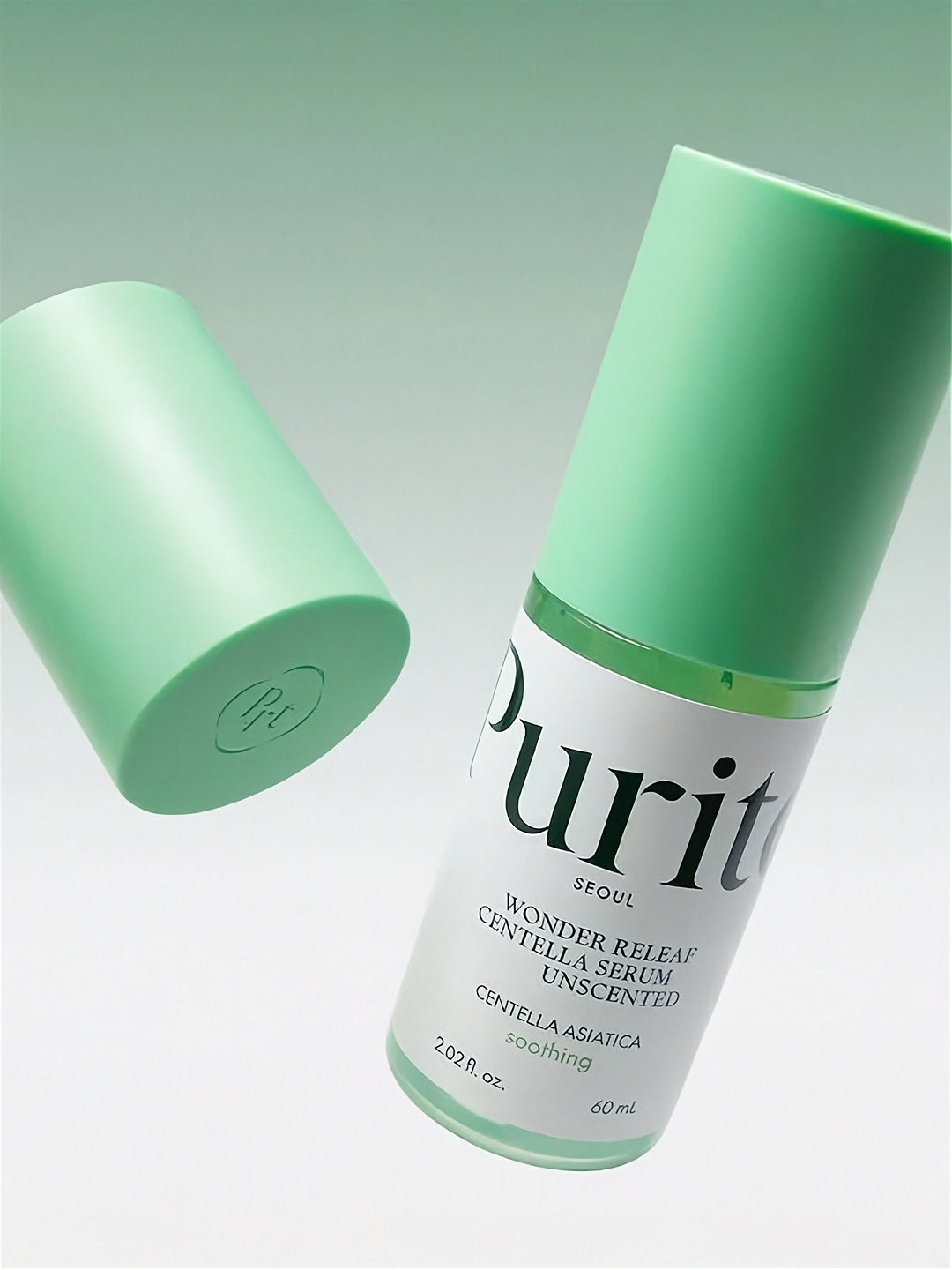 Purito Wonder Releaf Centella Serum Unscented bottle floating in front of a light gradient green background