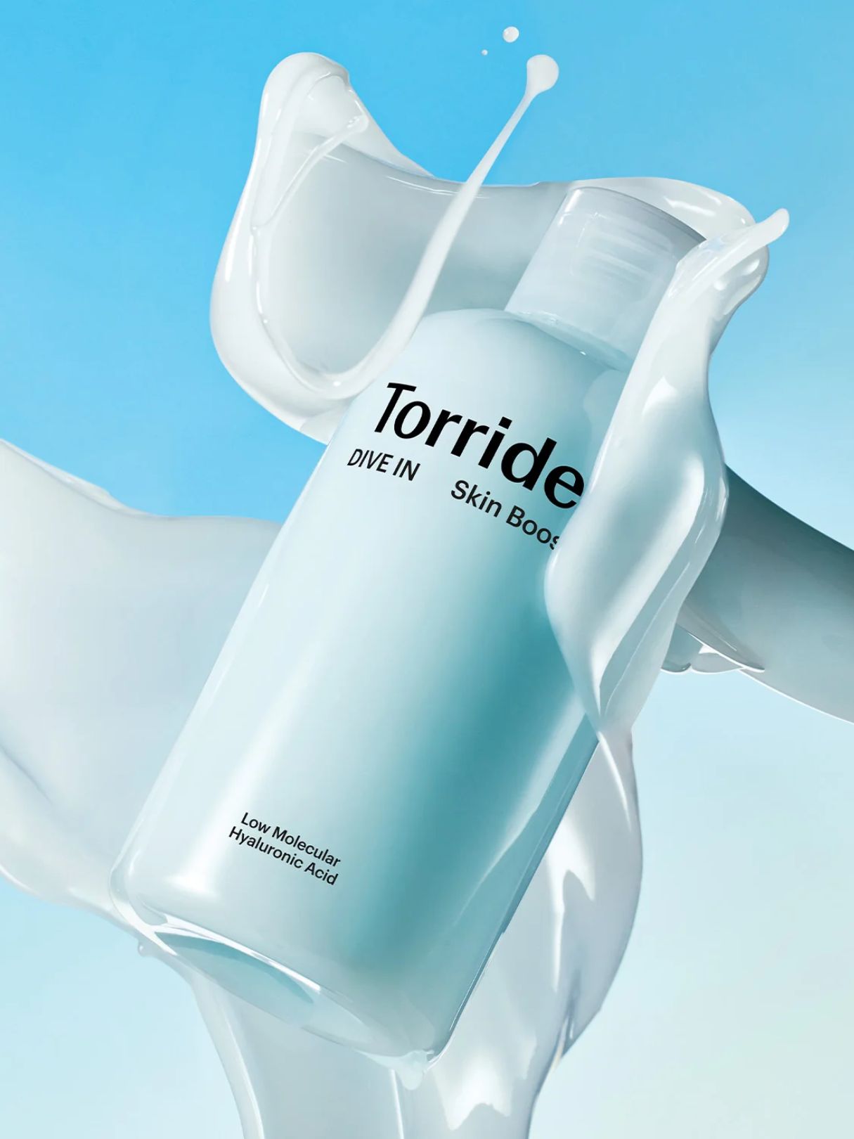 A bottle of Torriden Dive In Skin Booster with a light blue gradient label, surrounded by a glossy white liquid splash against a light blue background.