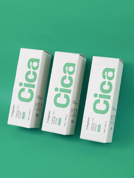 Vegreen fragrance-free cica serum packaging against a green background.