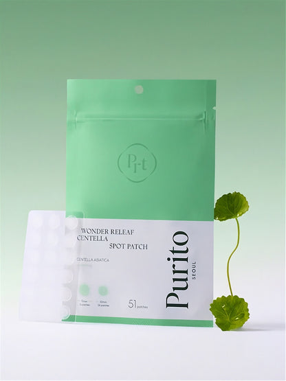 Purito Wonder Releaf Centella Spot Patch packaging with cica plant on a gradient green background