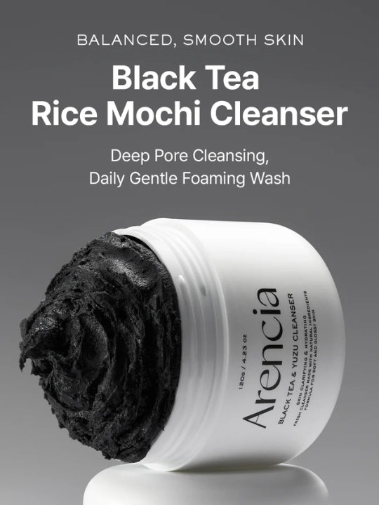 A white jar of Arencia Black Tea Rice Mochi Cleanser with a swirl of thick black cleanser visible on the left side, set against a dark gray gradient background with product text above.