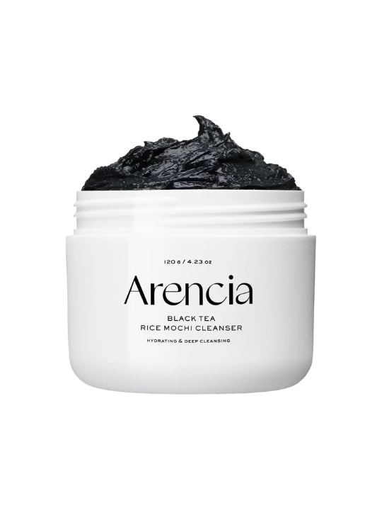 A white jar of Arencia Black Tea Rice Mochi Cleanser with a scoop of black charcoal cleanser visible at the top, set against a plain white background.