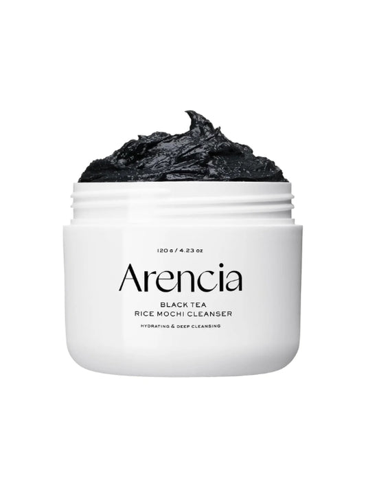 A white jar of Arencia Black Tea Rice Mochi Cleanser with a scoop of black charcoal cleanser visible at the top, set against a plain white background.