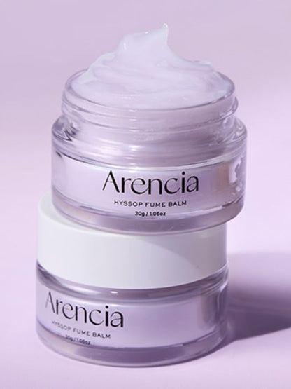 Two jars of Arencia Hyssop Fume Balm on pink background