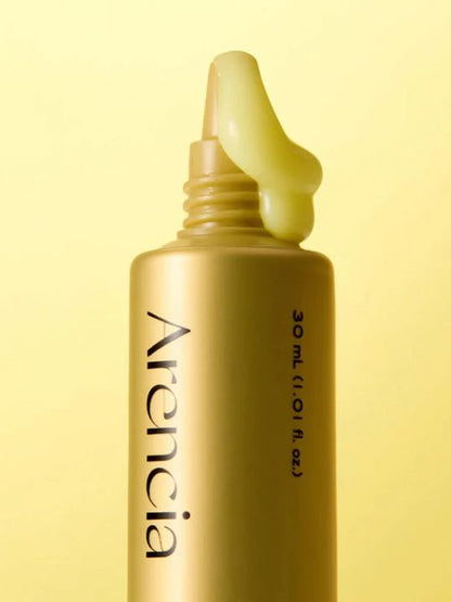 Close up of Arencia Retinal Booster Shot tube showing brand name and yellow cream coming from the top