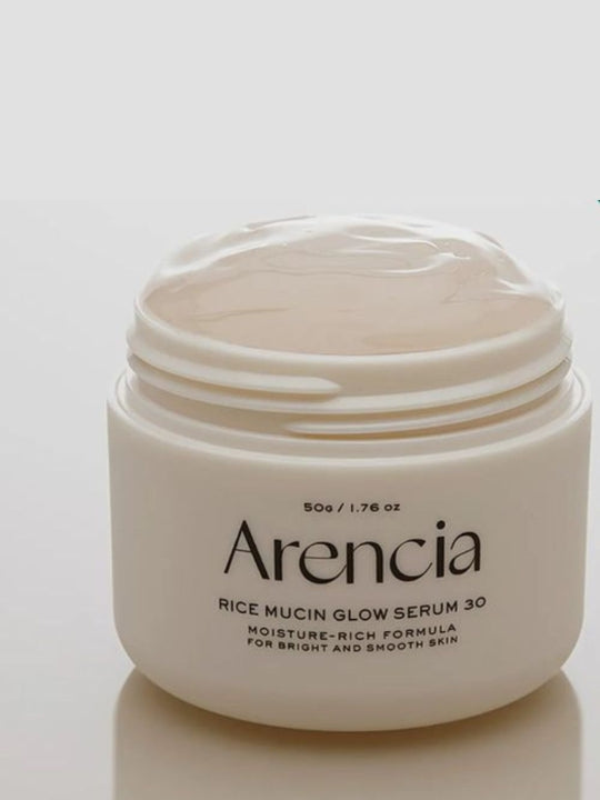 A jar of Arencia Rice Mucin Glow Serum 30, shown open with the jelly serum visible inside, on a clean white background.
