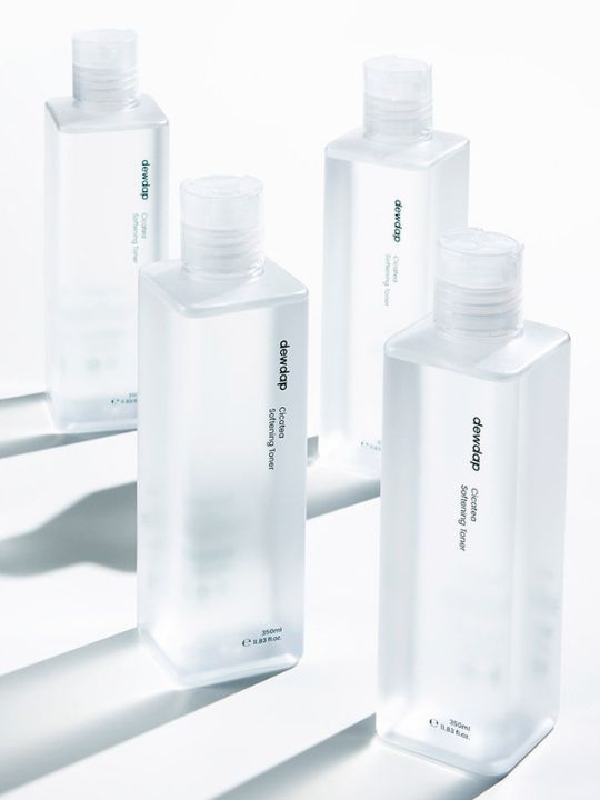 Four bottles of Dewdap Cicatea Softening Toner standing on a white background with shadows