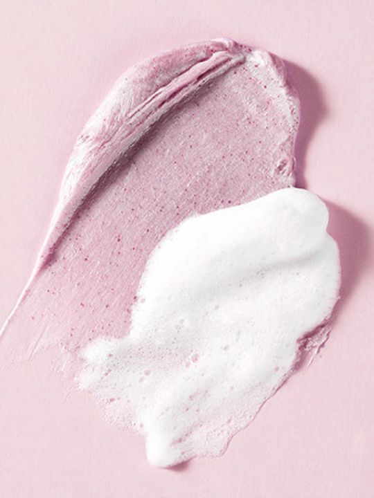 Two texture swatches of Dewdap's Dewtox Lift Boosting Pack Cleanser on a light pink background