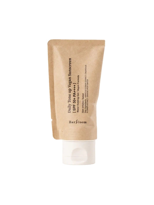 A tube of Herbloom Daily Tone Up Vegan Sunscreen SPF 50+ PA+++ in a kraft paper style tube with a white flip-top cap, shown on a plain white background.