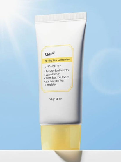 Klairs All Day Airy Sunscreen tube on a light blue sky background