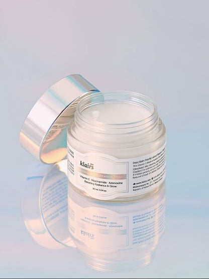Klairs Freshly Juiced Vitamin E Mask on a light blue reflective background