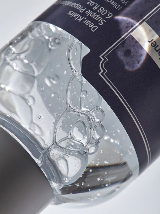 Close-up of Klairs Supple Preparation Toner Unscented bottle showing bubbly texture inside