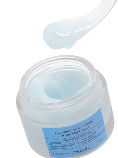 Open jar of Meisani Niacinamide Cucumber Aqua Gel Cream with spatula against white background