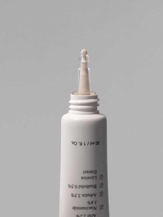 Ondo Beauty Tranexamic Acid & Licorice Dark Spot Treatment open on a grey background
