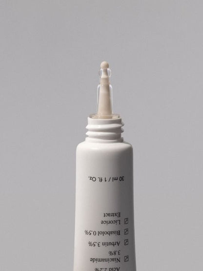 Ondo Beauty Tranexamic Acid & Licorice Dark Spot Treatment open on a grey background
