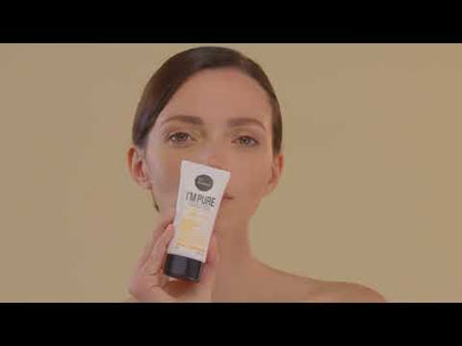 Model applying Suntique I'm Pure Perfect Cica sunscreen on a beige/yellow background