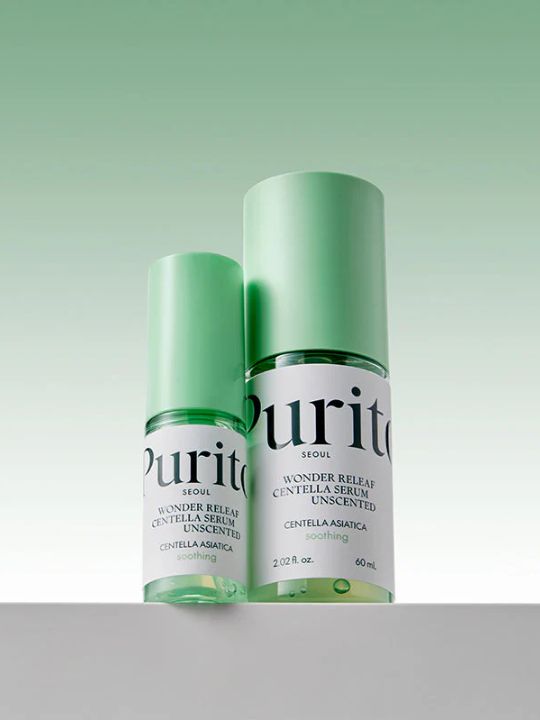 Two different sizes of serum bottles from Purito Wonder Releaf Centella Unscented on a gradient green background