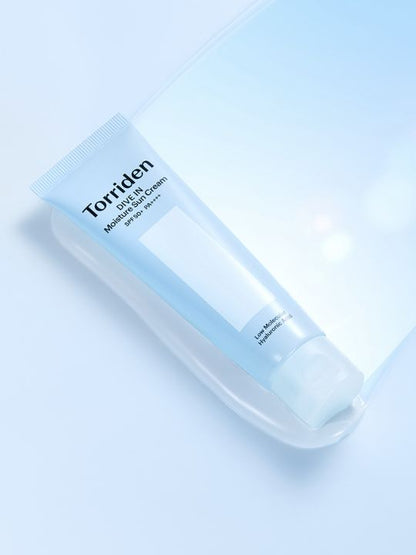 Tube of Torriden Dive In Moisture Sun Cream lying on a gel-like surface