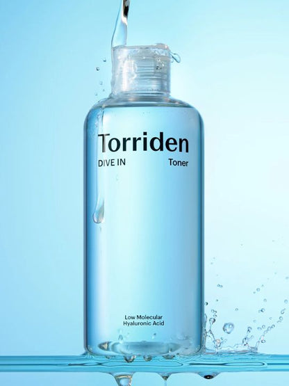 Bottle of Torriden Dive In Toner with water droplets on a light blue background