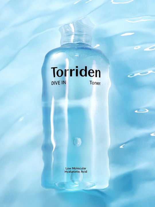 Bottle of Torriden Dive In Toner immersed in blue water
