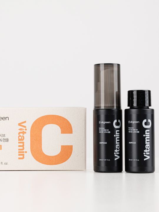 Two bottles of Vegreen Intensive Vitamin C Ampoule standing next to their retail box