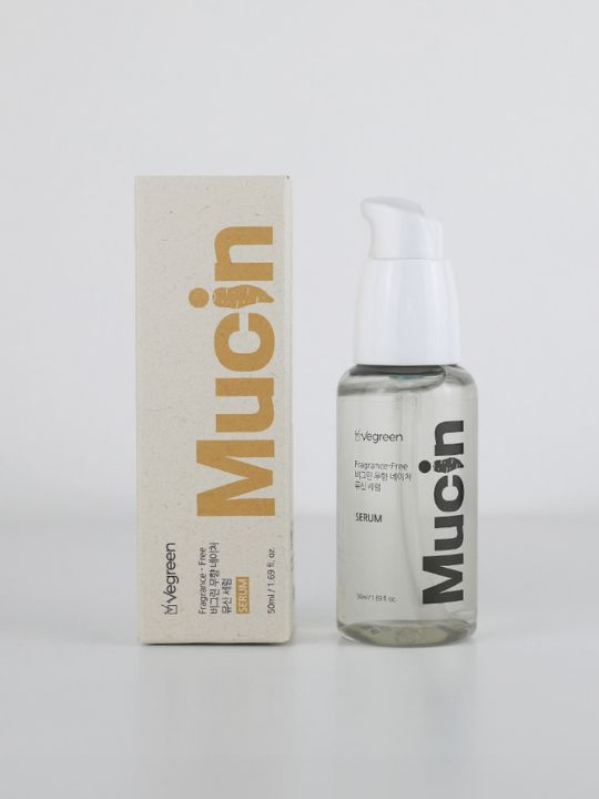 Bottle of Vegreen Fragrance-Free Nature Serum standing next to its retail box against a light grey background