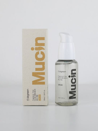 Bottle of Vegreen Fragrance-Free Nature Serum standing next to its retail box against a light grey background
