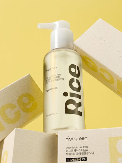 Pump bottle of Vegreen Rice Daily Moisture Pore Cleansing Oil standing on its retail boxes against a yellow background